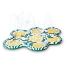 two plates with lemons and leaves on them