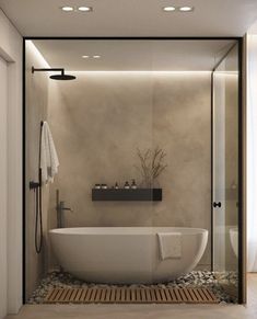 a white bath tub sitting next to a walk in shower