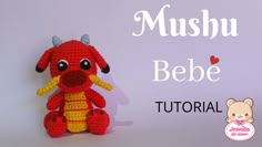 a crocheted stuffed animal with the words mushu bebe written below it