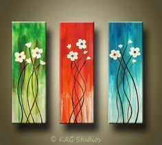 three paintings with flowers painted on them