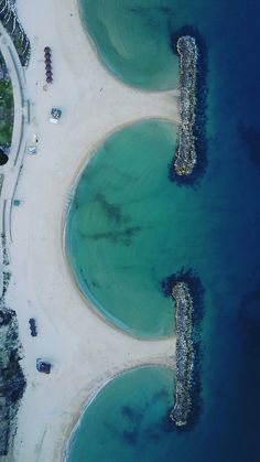 an aerial view of the beach and ocean