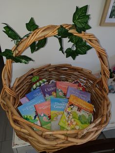 a wicker basket filled with children's books