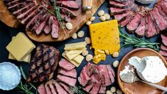 various meats and cheeses on wooden platters