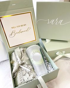 an open box containing a personal care product and a card that says will you be my bridesmaid?