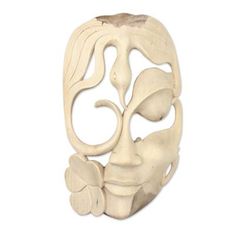 a wooden mask is shown on a white background