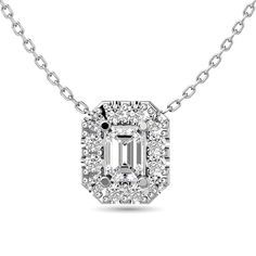 Diamond Emerald Cut Single Halo Pendant 1/4 ct tw in 14K White Gold (1/6ct tw Centre)PRODUCT INFORMATIONMetal: 14k White GoldSTONE INFORMATIONStone Type: DiamondNumber of Stones: 13Shape: Round / Emerald CutColor: G-HClarity: I1-I2Carat Weight: 0.25 CTWSetting: Shared Prong Halo Necklace, Diamond Pendants, White Gold Chains, Halo Pendant, Emerald Cut Diamond, Double Halo, White Gold Jewelry, Timeless Jewelry, Emerald Cut Diamonds