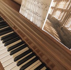 an old piano with sheet music on it