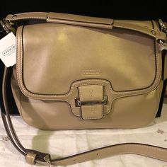 This Coach Cross Body Champagne Colored Bag Is So Soft And A Really Nice Size That Is Great For Everyday Or Traveling. It Has Plenty Of Pockets. This Is A New Bag That Still Has Some Of The Protective Covering Attached But Some Has Been Removed To Show More. No Scratches Or Scuffs. Great For This Summer And Fall. Flap Bag With Silver-tone Hardware, Coach Beige Shoulder Bag With Silver-tone Hardware, Beige Flap Shoulder Bag With Branded Hardware, Elegant Satchel With Silver-tone Hardware And Flap, Elegant Flap Satchel With Silver-tone Hardware, Everyday Flap Bags With Silver-tone Hardware, Everyday Bags With Silver-tone Hardware And Flap, Coach Beige Office Bags, Beige Office Bag With Silver-tone Hardware