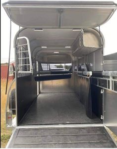 the inside of a horse trailer that is empty