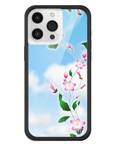 an iphone case with pink flowers and green leaves on the front, against a blue sky background