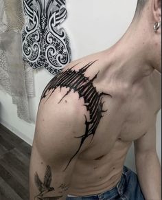 a man with a tattoo on his back