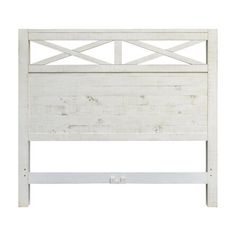 a white headboard with wooden slats on the top and bottom part of it