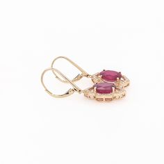 These beautiful dangle earrings feature a pair of 7.28 carat weight Ruby gemstones with natural earth mined diamonds and milgrain detail, all set in solid 14K gold. These Ruby dangles make a lovely July birthstone gift for your loved ones! These earrings are made with solid 14k Gold and natural earth mined SI / G-H Diamonds. As listed, these earrings are ready to ship. If you're interested in purchasing this setting with a different center stone please message us! Jewelry Appraisal, July Birthstone, Ruby Gemstone, Custom Jewelry Design, Natural Earth, Birthstone, Ruby, Dangle Earrings, Jewelry Design