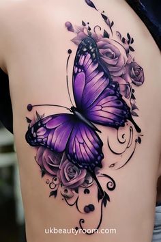 a woman's back with a purple butterfly and roses tattoo on the side of her body