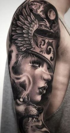 a man's half sleeve with an image of a woman and a wolf on it