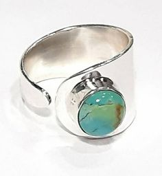 Tibetan turquoise ring 925 Sterling silver band Adjustable band Turquoise band Turquoise swirl band Turquoise open band December birthstone ring Birthday gift Turquoise gemstone ring Natural turquoise jewelry 925 Silver jewelry Natural gemstones jewelry Bridal ring Wedding jewelry Minimalist Greek jewelry  Dimensions: Ring width 1.4 cm Turquoise gemstone diameter 0.8 cm Adjustable Adjustable Turquoise Chrysocolla Ring, Unique Turquoise Open Ring, Unique Open Turquoise Ring, Mystic Topaz Jewelry, Silver Leaf Ring, Mystic Topaz Earrings, Gemstone Ring Silver, Sterling Silver Rings Turquoise, Citrine Jewelry