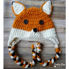 a crocheted fox hat is shown with the text, woodland fox hat free pattern