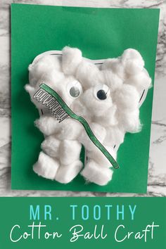 an animal made out of cotton ball with the words mr toothy on it