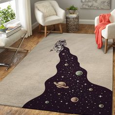 a living room with a rug that has an image of the planet and stars on it