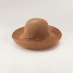 A hallmark Helen Kaminski silhouette, the Provence hat is handcrafted from over 14,000 stitches of sustainably harvested raffia. Paired with a classic rounded crown, the flexible brim can be rolled up or down for custom sun coverage. Hand-rolled raffia tie Turn-up brim Rounded crown Goldtone seed logo 100% Madagascan raffia Spot clean Made in Sri Lanka Measurements Brim: 4.72in Handwoven Toquilla Straw Hat With Curved Brim, Natural Color Hat With Curved Brim, Natural Color Curved Brim Hat, Handwoven Curved Brim Hat For Kentucky Derby, Woven Panama Hat With Curved Brim, Elegant Hats With Curved Brim In Paper Straw, Woven Sun Hat With Curved Brim, Handwoven Flat Brim Crochet Hat In Toquilla Straw, Handwoven Toquilla Straw Sun Hat With Curved Brim