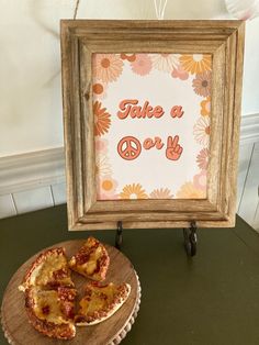 there is a piece of pizza on a plate next to a sign that says take a day