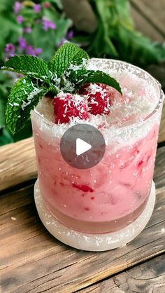 a strawberry mousse is garnished with powdered sugar and fresh mint