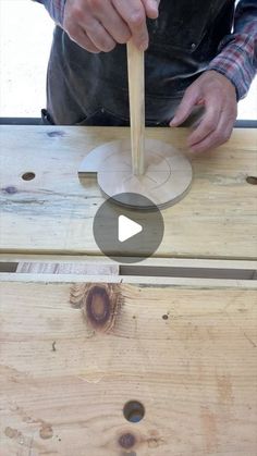 a man working with wood on a piece of furniture