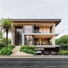 a modern house with lots of plants and trees