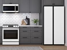 a white stove top oven sitting inside of a kitchen