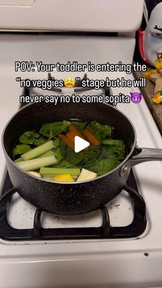 a pan filled with vegetables sitting on top of a stove next to a white oven