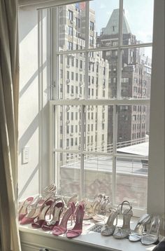 there are many pairs of shoes on the window sill