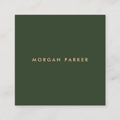 a green business card with the word morgan parker on it in gold foil lettering