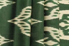 green and white fabric with an abstract design