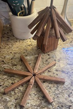 a wooden snowflake sitting on top of a kitchen counter