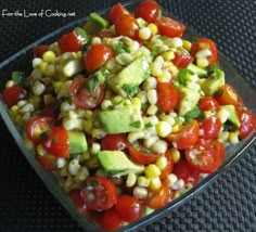 an image of a salad with tomatoes and avocado on the bottom right side