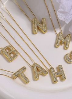 This necklace truly pops with its sparkling rhinestone bubble pendant. Its initial charm adds a personalized touch. Perfect for making a statement at any event or a unique addition to your everyday look. Necklace comes in a variety of letters. Balloon Necklace, Letter Charm Necklace, Gold Letter Necklace, Gold Necklace Simple, Bubble Balloons, Sunglass Chain, Initial Pendant Necklace, Monogram Necklace, Gold Dipped