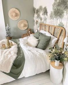 a bedroom decorated in white and green tones