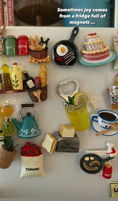 a refrigerator covered in magnets filled with different types of kitchen utensils and food