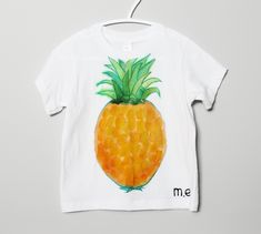 A hand painted illustration of a pineapple on a short sleeve, white crew neck t-shirt. Excellent quality and 100% cotton. Hand painted on a t-shirt from the brand American Apparel Size 12-18 months All t-shirts have been hand painted with care with quality fabric paint that has been heat set to resist fading. T-shirts are pre-washed with phosphate free detergent to reduce further shrinkage. Recommended care: Turn garment inside out and wash on delicate cycle or preferably by hand in warm or cold Toddler Painting, Painted Illustration, Painted Rainbow, White Crew Neck, Art To Wear, Top Baby Products, Baby T Shirts, Paint Print, Custom Sweatshirts