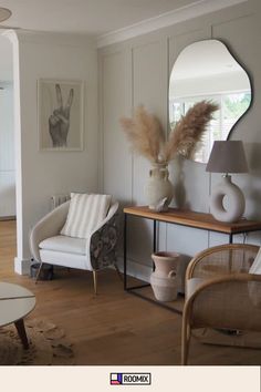 a living room filled with furniture and a large mirror