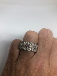 Unusual Deep Ruby and white sapphire Sterling Filigree Setting Handmade size 7 Can be resized. My jeweler charges a $10-$20 fee All rings are shipped free in a the US in a nice gift box. Check out our over a THOUSAND great reviews Engraving is $4 per letter and is not always perfect depending on the piece. It can take a few days if the jeweler is busy. This is payable to Paypal Judithsltd@gmail.com White Ruby Ring With Vvs Clarity, Classic Silver Ruby Ring For Valentine's Day, White Ruby Promise Ring In Fine Jewelry Style, Fine Jewelry White Ruby Promise Ring, Dazzling White Gold Ruby Ring With Diamond Accents, Silver Ruby Ring In Fine Jewelry Style, Silver Diamond Ruby Ring Fine Jewelry, Luxury Silver Ruby Ring For Anniversary, Silver Ruby Ring With Diamond