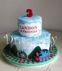 a birthday cake with thomas the train on top