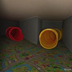 three plastic buckets are sitting in the corner of a room with colorful carpeting