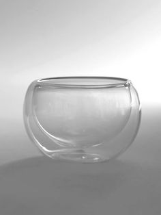 a glass bowl sitting on top of a table