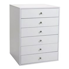 a white chest of drawers with five drawers