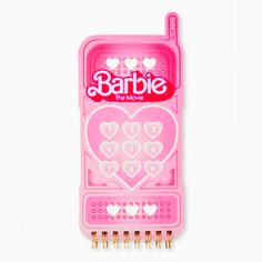 a pink comb with hearts on it and the word barbie written in white letters is shown