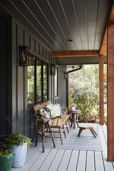 a porch with chairs and tables on it