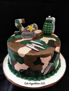 a camouflage cake with tools on top