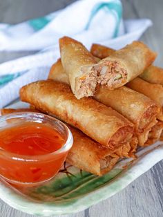 some food on a plate with dipping sauce