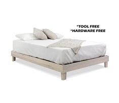 a bed with two pillows on it and the words tool free hardware free above it